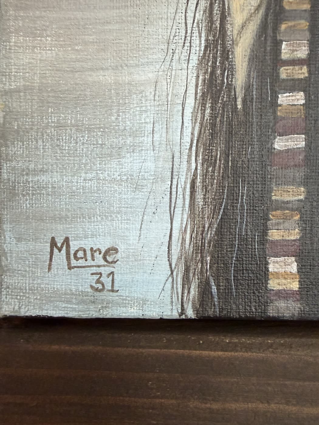 Close-up of a painting's corner, signed Mare, underlined, with the number 31 beneath.